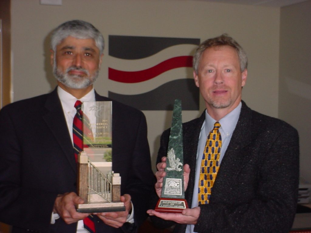 Uday Bhate and Chuck Burgin holding Associated Builders and Contractors Awards